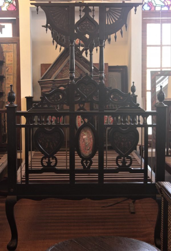 FOUR POSTER BED WITH COLOURFUL DECORATION